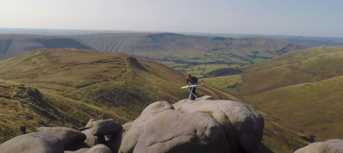 Person ironing standing on the rock 