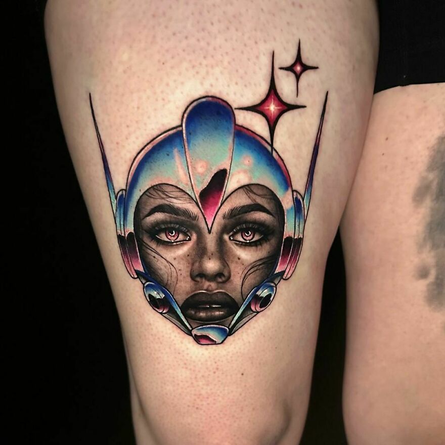 A futuristic space tattoo featuring a helmeted face with stars in the background, showcasing cosmic artistry.