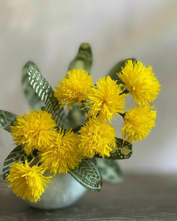 a yellow wattle flowers made out of the paper