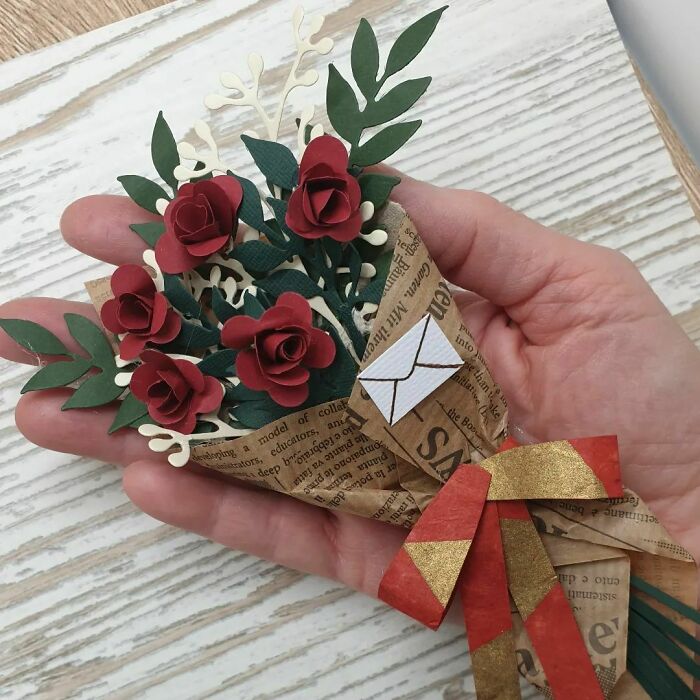 red roses made out of a paper in a package