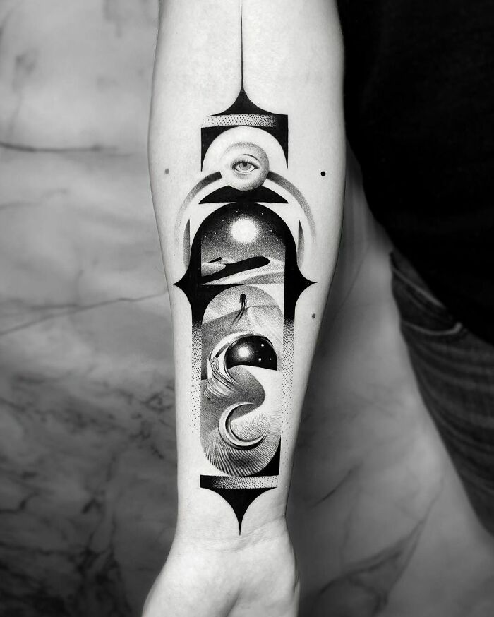 Abstract space tattoo on forearm featuring cosmic designs and celestial elements for astrology enthusiasts.