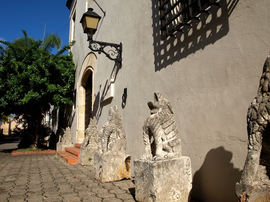 Stone Gargoyles Alongside A Colonial Building