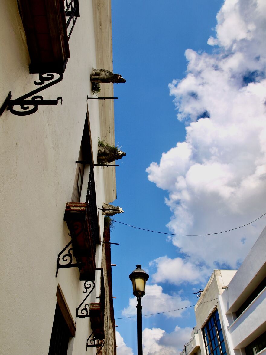 Casa De Gargolas (House Of The Gargoyles) Seemingly Blowing The Clouds Away