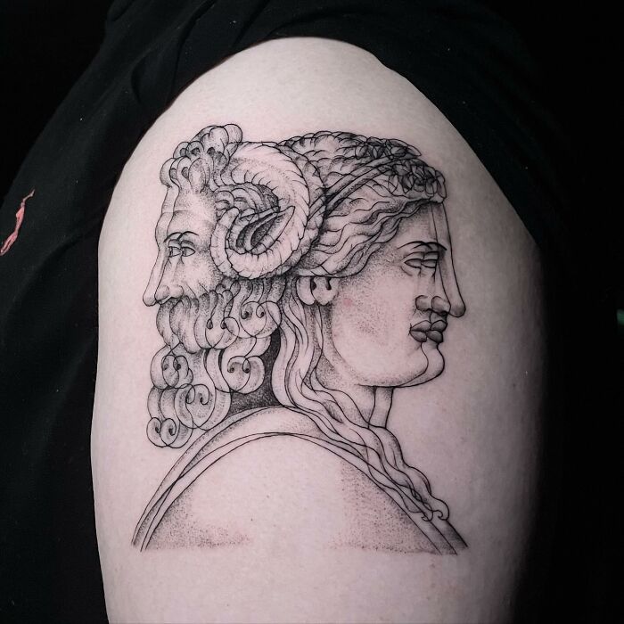 Tattoo of two faces, featuring a detailed ram with curly horns, creating a moving illusion effect on the skin.