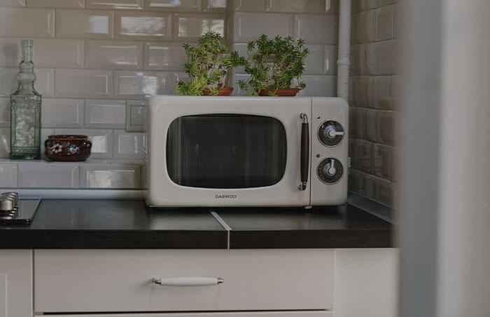 White microwave on the kitchen table