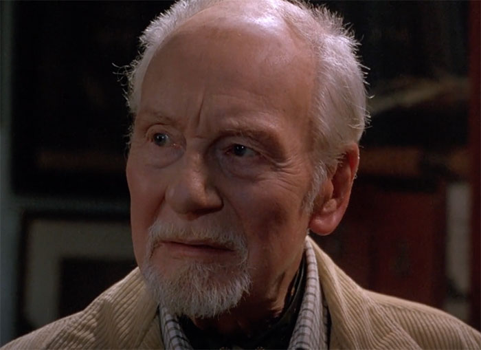 John Gielgud standing and looking in movie