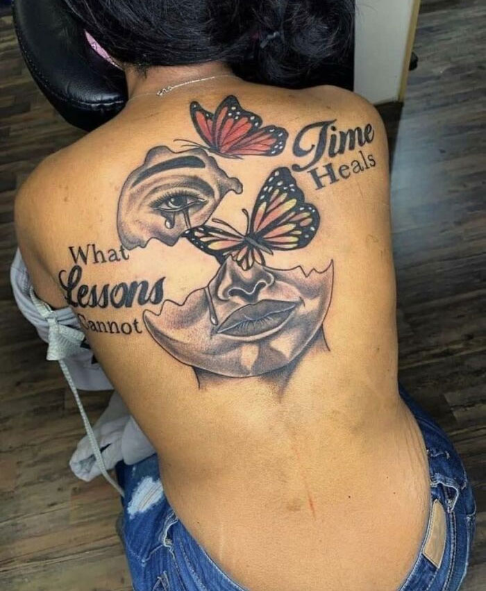 Bad tattoos featuring a surreal design with butterflies and text on a person's back.