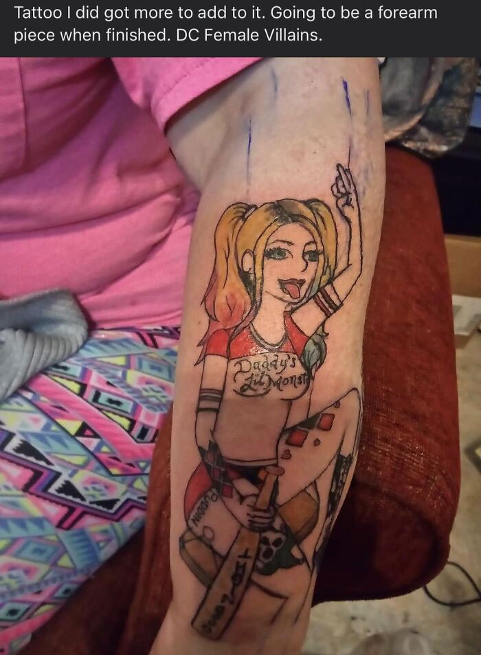 Bad tattoo of a DC female villain character on forearm, work in progress.