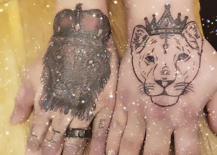 Bad tattoos of crowned lion and lioness on hands, sparkling filter effect.
