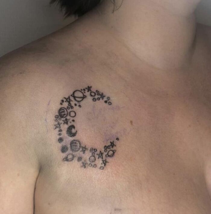 Bad tattoos design featuring celestial symbols on shoulder.