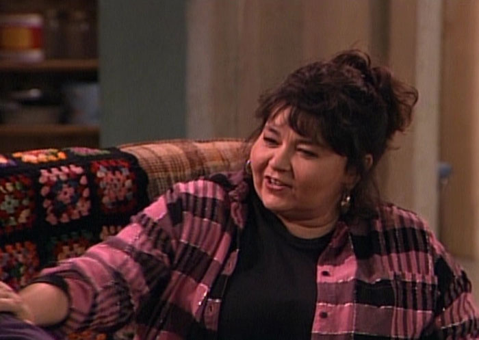 Roseanne Conner is sitting on the sofa and talking