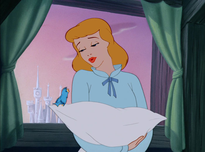 Cartoon character holding a pillow with a blue bird, set against a fairytale castle background.