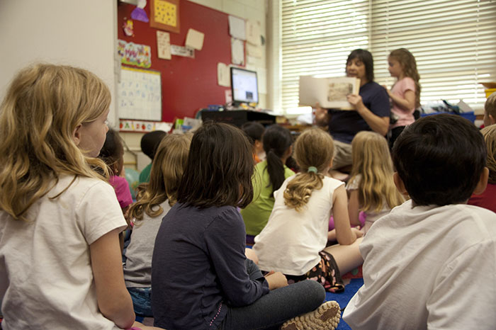 Children sitting on the floor in the school