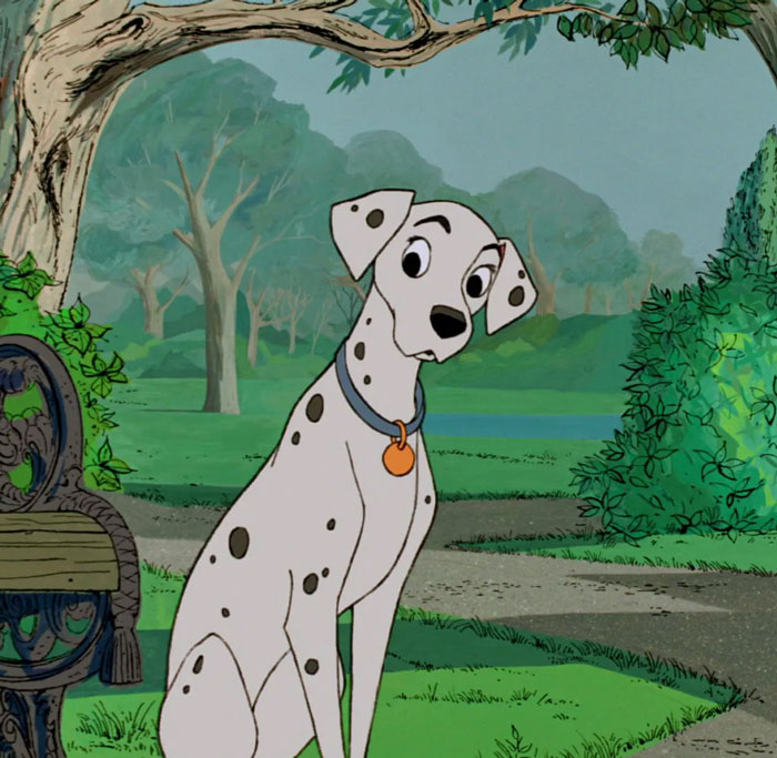 Cartoon dog, a Dalmatian, sitting in a lush park, symbolizing cuteness.