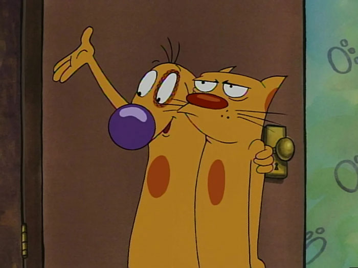Cartoon dogs CatDog, an iconic duo, standing together in a doorway, showcasing their unique combined form.