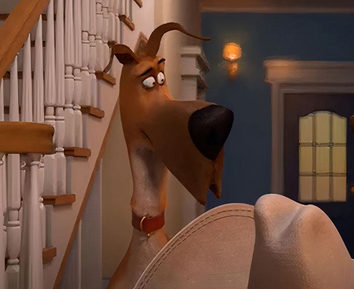 Animated cartoon dog with large nose and brown fur standing by a staircase, wearing a red collar.