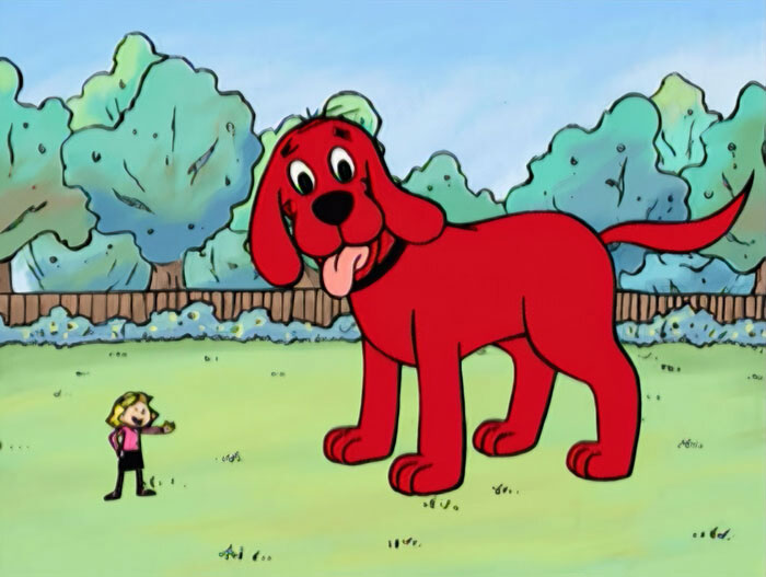 Giant red cartoon dog in a park with a girl, showcasing cuteness.