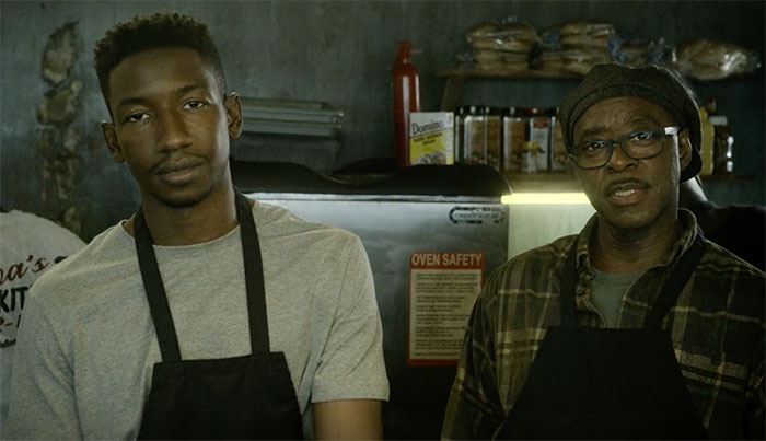 Elijah watching and wearing gray shirt