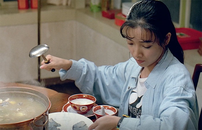 Eat Drink Man Woman character wearing blue shirt and eating