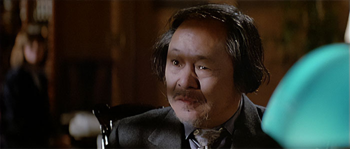 Victor Wong looking at someone 