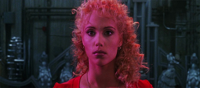 Elizabeth Berkley looking at someone 