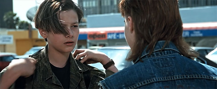 Eddie Furlong looking and talking to someone 