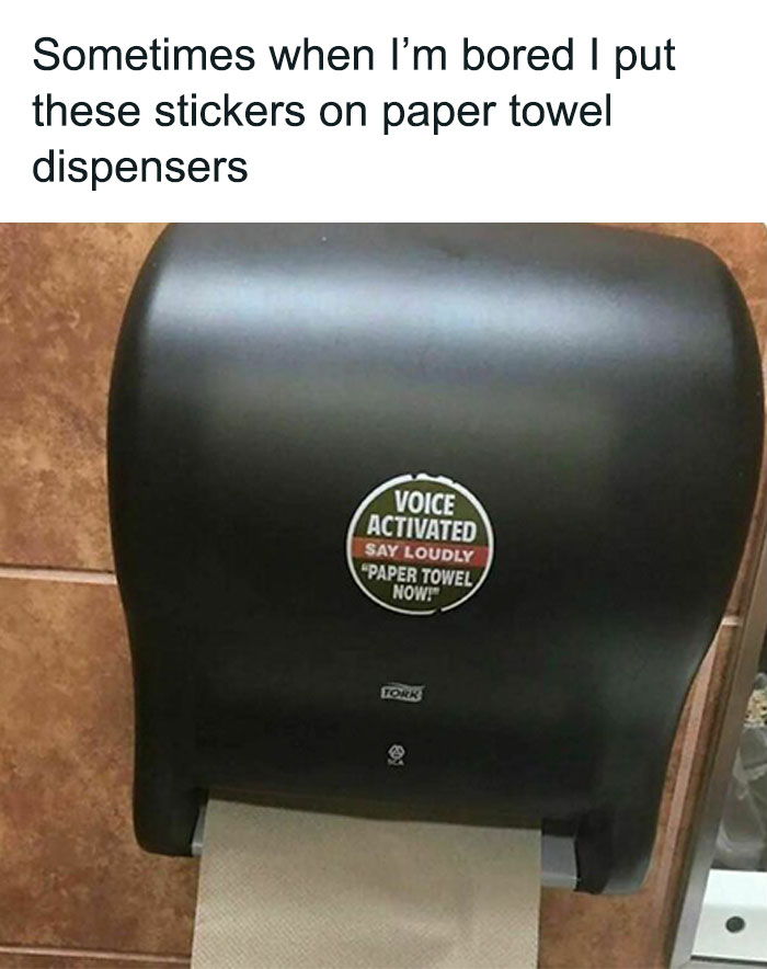 Paper towel dispenser with a humorous "voice activated" sticker, a relatable meme causing laughter.