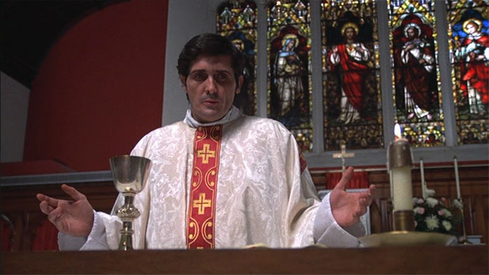 Father Karras giving a speech 