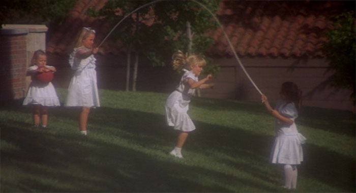A group of girls jumping the rope 