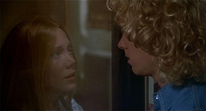 A woman talking to a man 