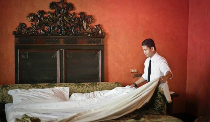 Person changing sheets