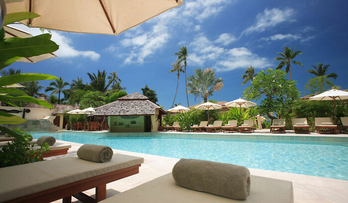 Swimming pool with chairs near