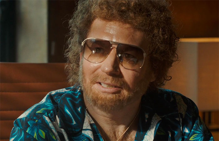 Mike Myers with glasses in movie Bohemian Rhapsody