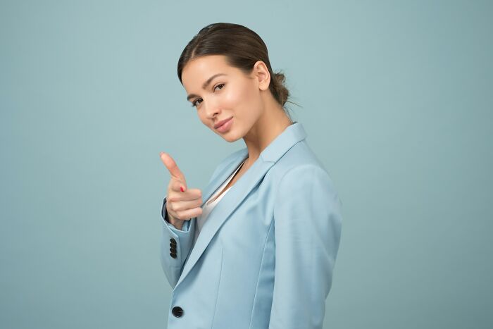 Confident Woman In Light Blue Suit 