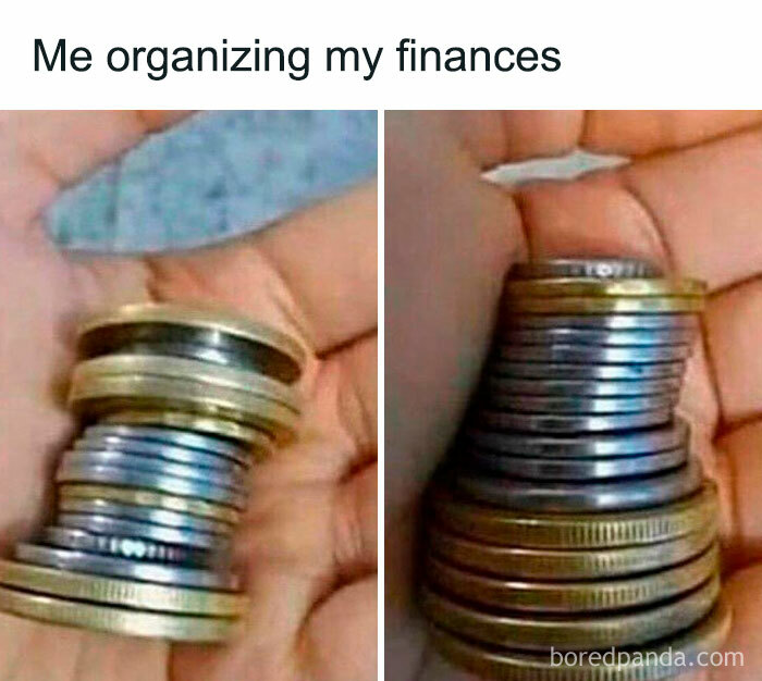 Hand holding a stack of organized coins, humorously illustrating money management.