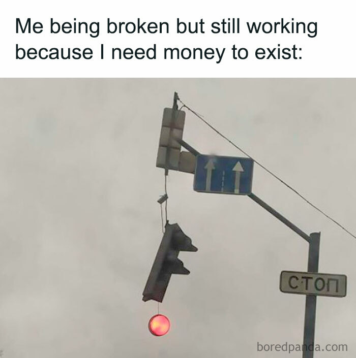 Traffic light hanging broken, symbolizing financial struggles, with a funny money meme text above.