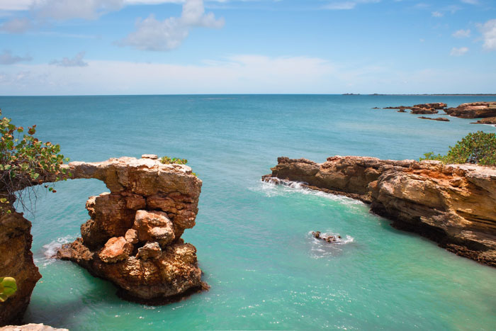 Rock filled beach near a sea 