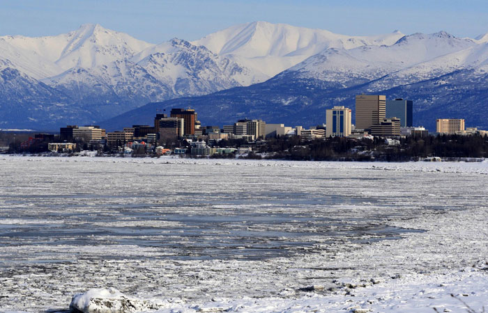 Town near mountains and a frozen lake 