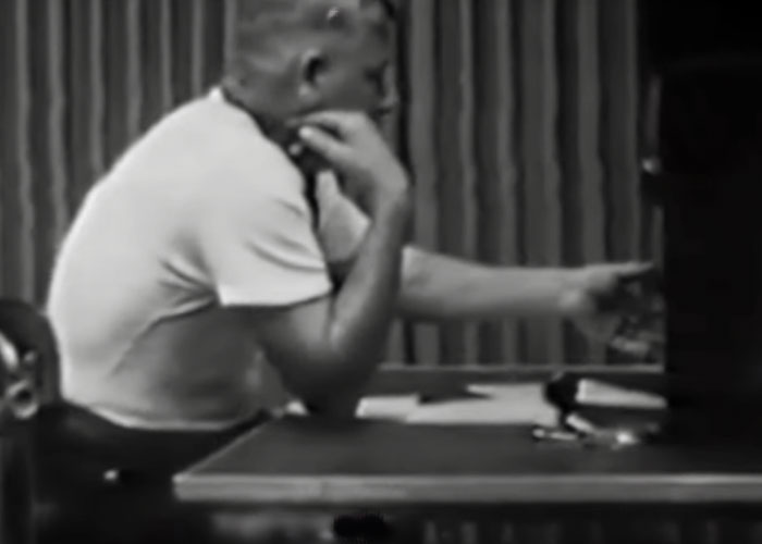 A person in a white shirt sitting at a desk, illustrating a topic about the scariest scientific discoveries.