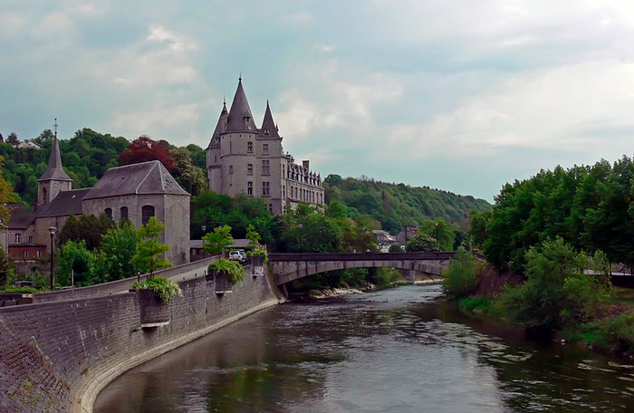 Buildings near a bridge above the river 