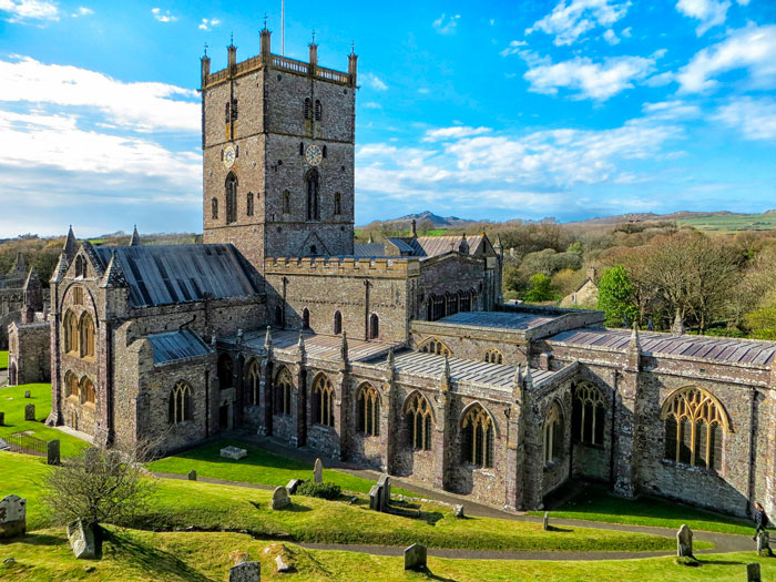 Massive gray castle in the meadow 