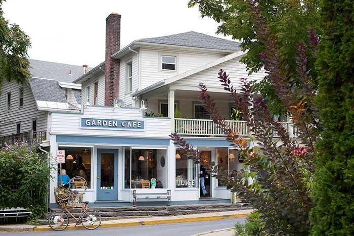 Cozy cafe in a city filled with people 