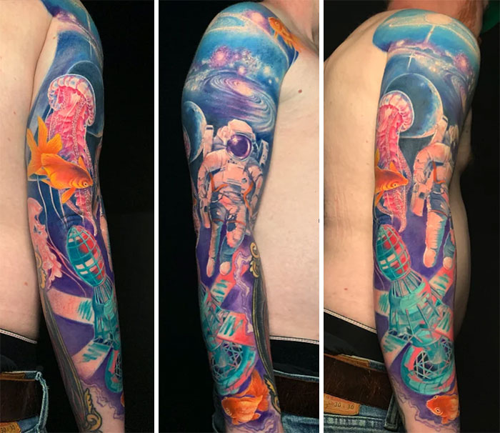 Colorful space tattoo sleeve featuring an astronaut, galaxy, and marine life elements.