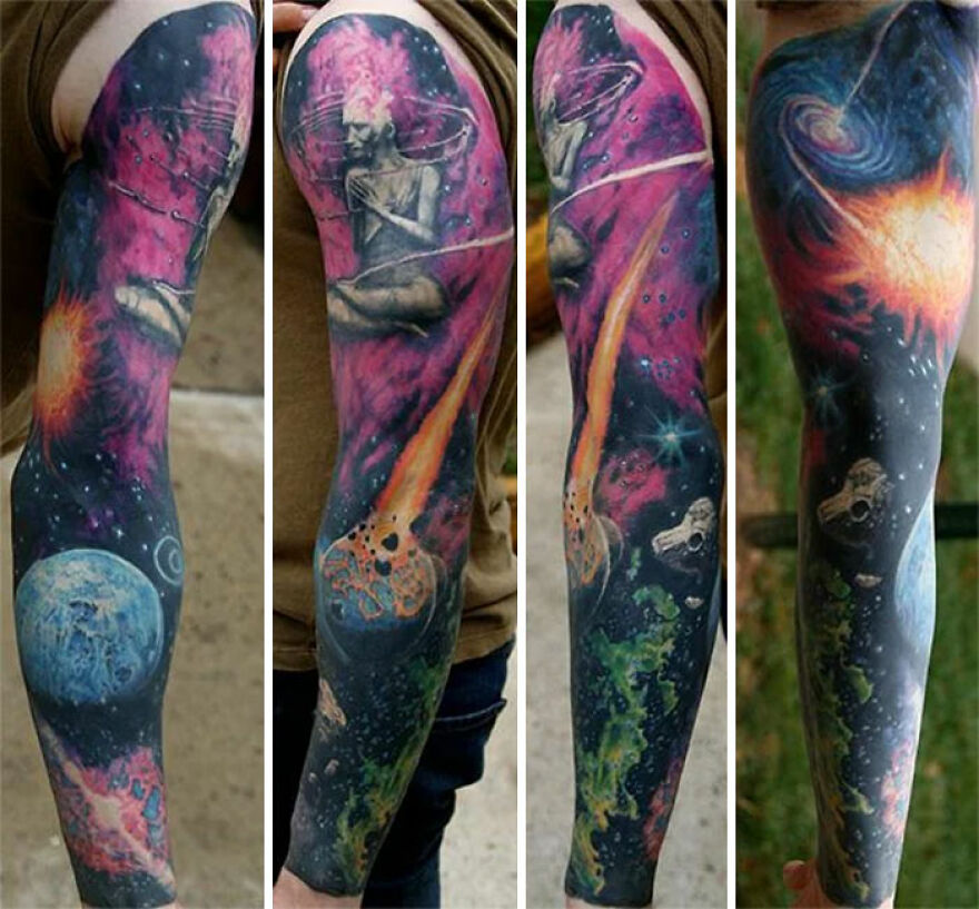 Colorful sleeve tattoo depicting outer space with planets, stars, and cosmic scenery.