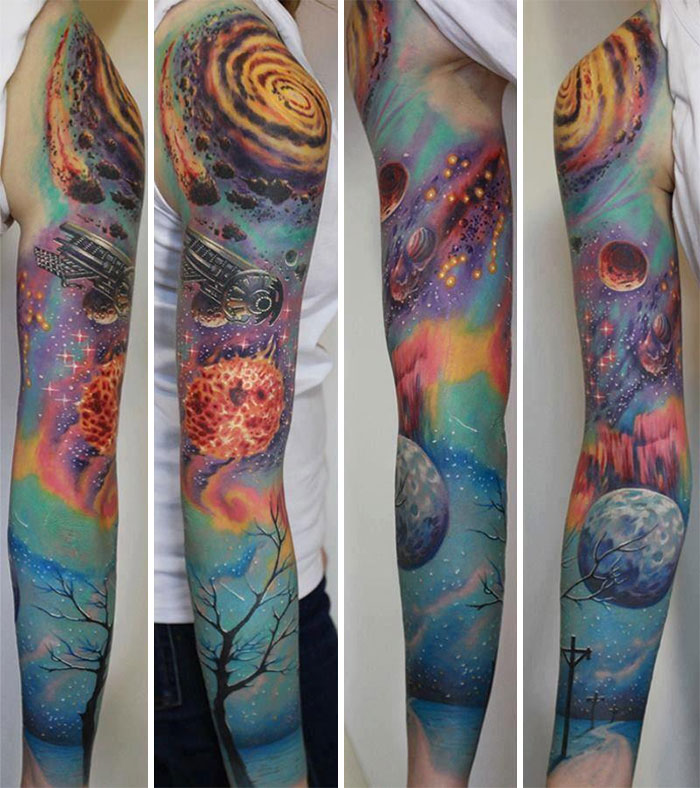 Vibrant sleeve tattoo featuring cosmic elements like galaxies, planets, and colorful nebulae in a cool space design.