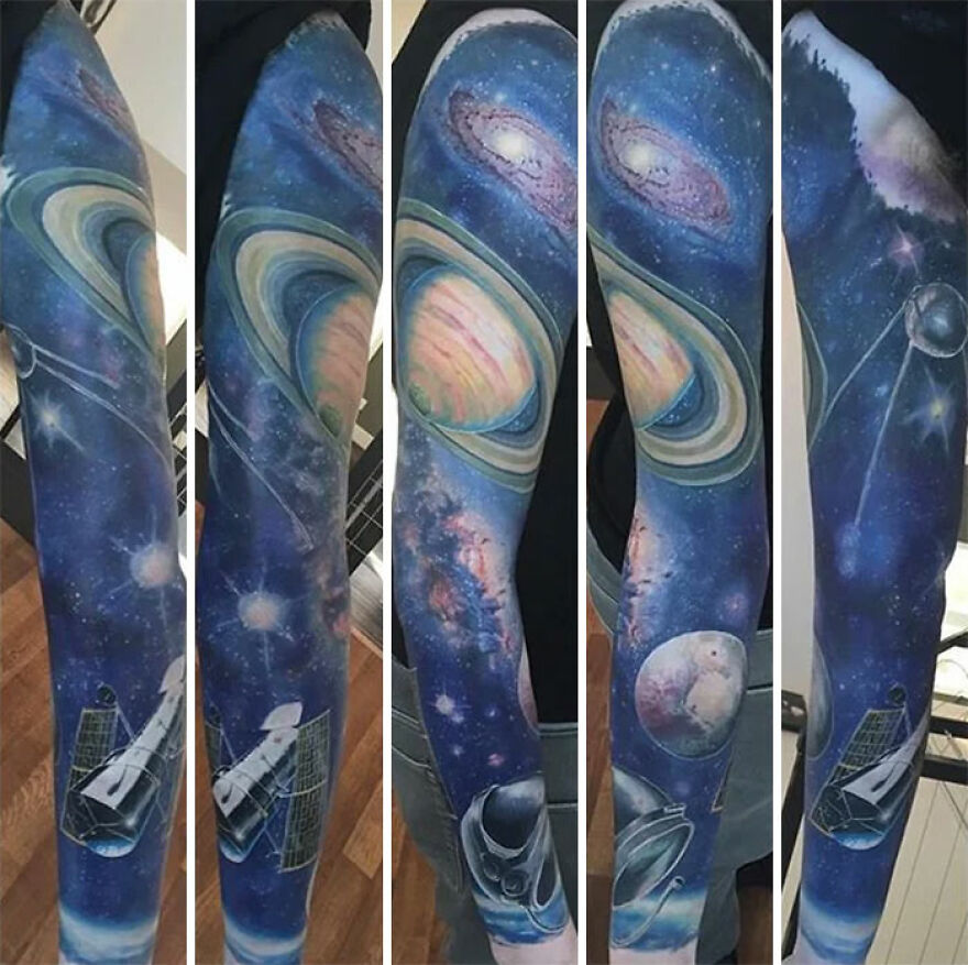 Outer space tattoo featuring planets, galaxies, and spacecraft on a person's arm sleeve.