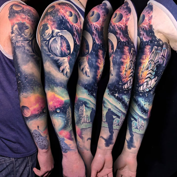 Vibrant arm sleeves with space tattoos featuring astronauts, planets, and galaxies, ideal for astrology enthusiasts.