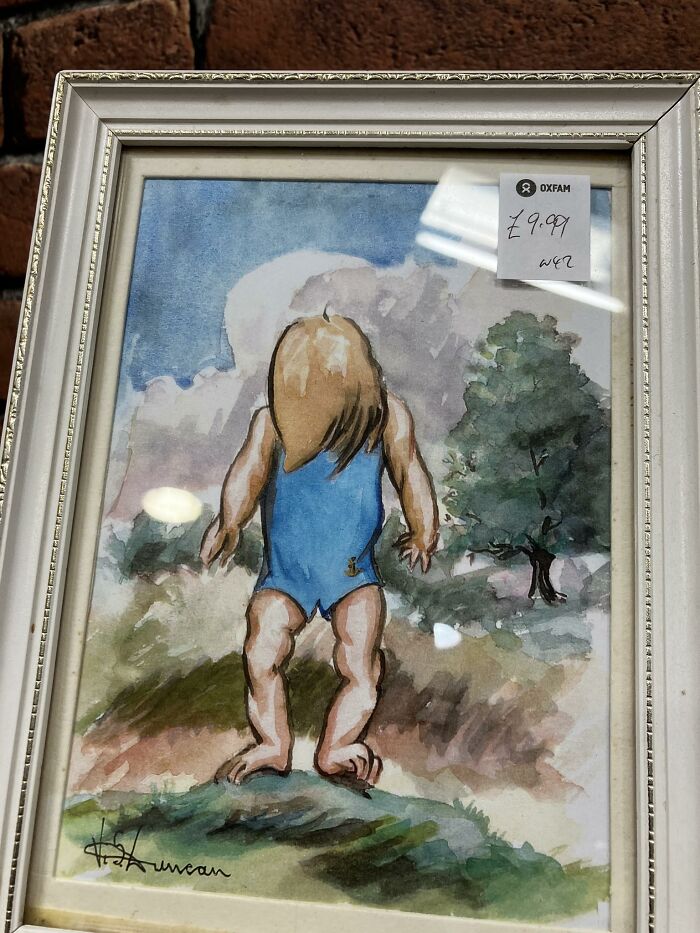 Genuinely Perplexed As To Whether This Is A Child Facing The Viewer Looking Down Or A Very Hairy Body Builder Looking Away