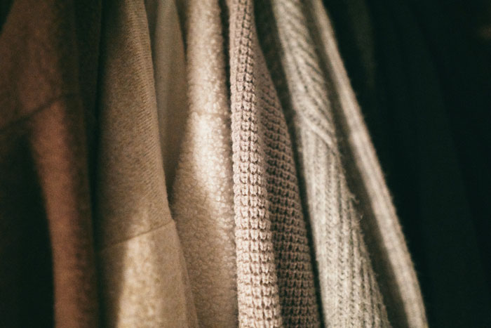 Close-up hanging light sweaters
