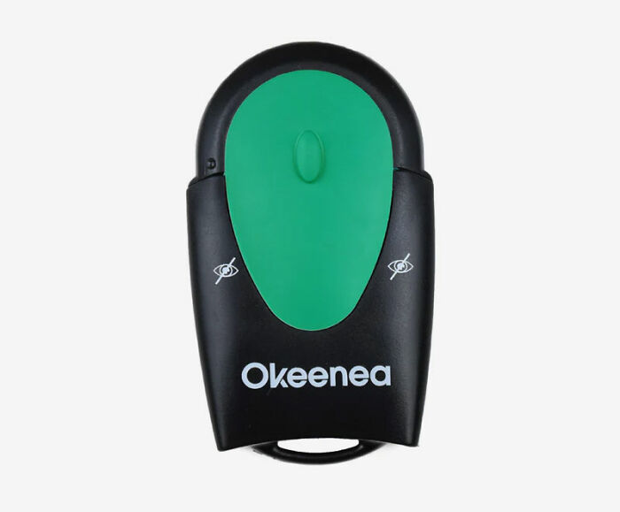 Innovative Okeenea gadget with green button and black casing, designed for urban accessibility.